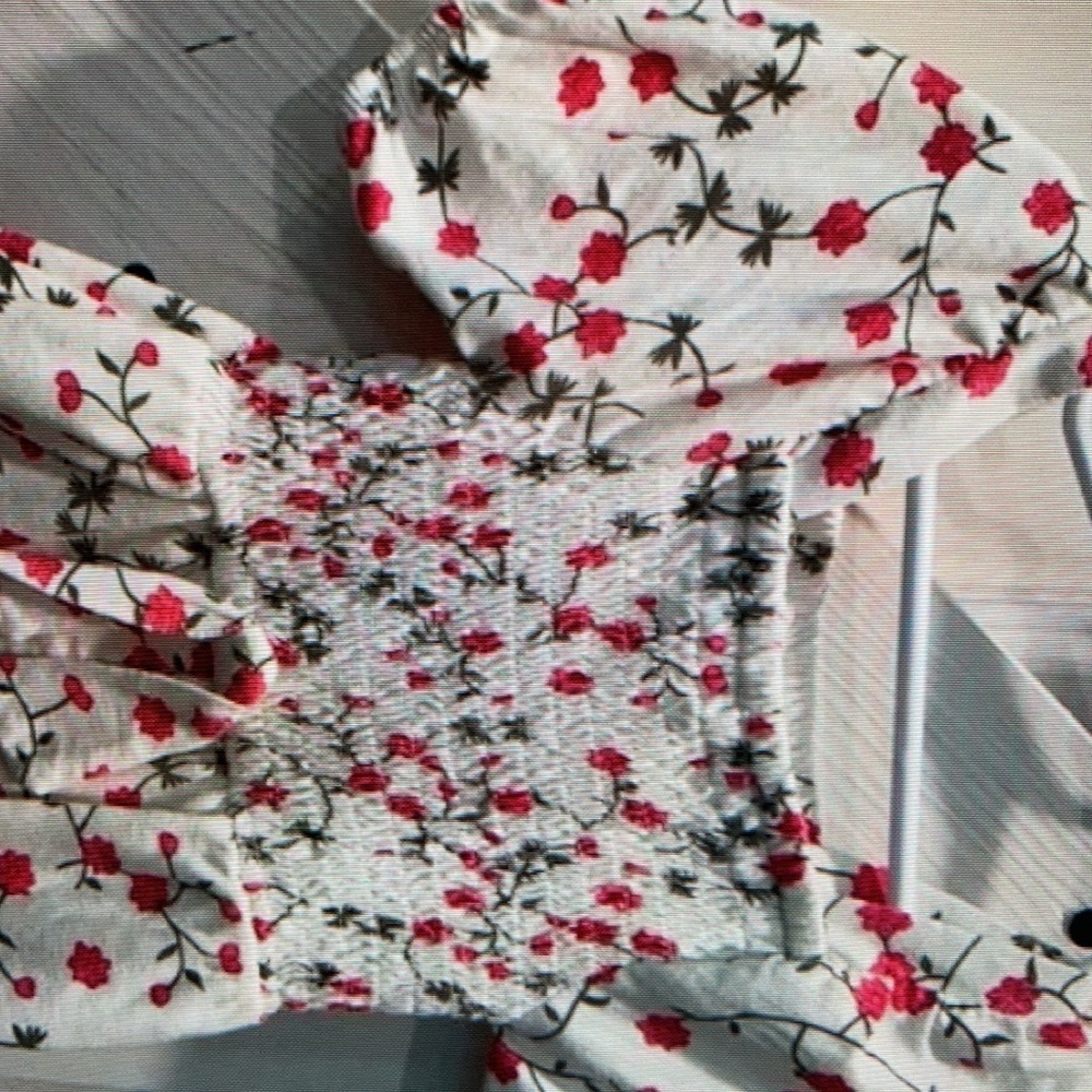 Chic bodysuit features a charming print
